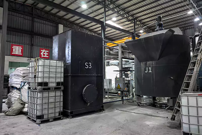 Precision feeding equipment dispensing raw materials at Sanlee Chemicals silicate plant.