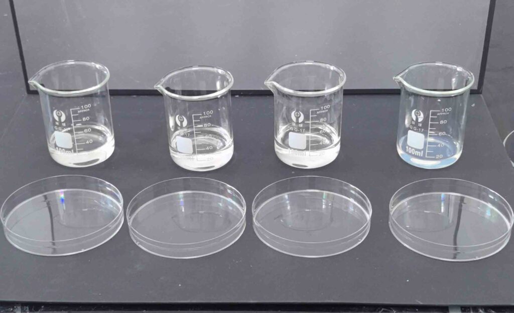 What is water glass - Sodium silicate solution in glass beaker with solid cullet pieces and molecular structure diagram