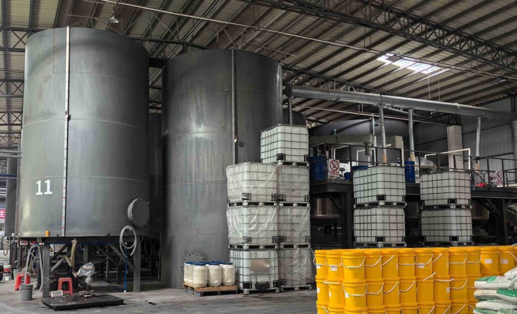 Sodium silicate production facility with industrial furnaces dissolving tanks and storage vessels for water glass manufacturing
