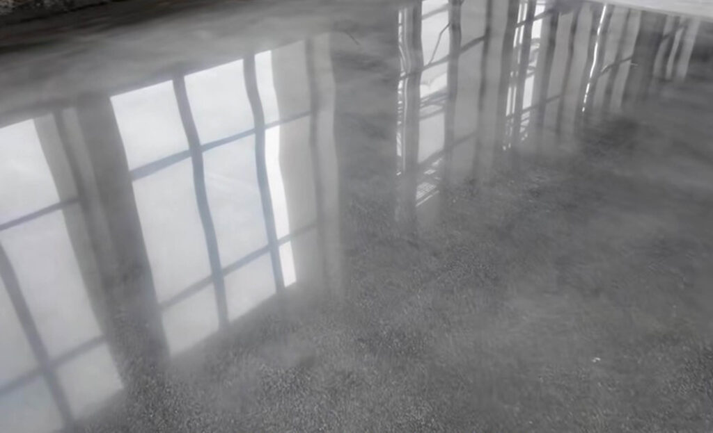 Floor coating doesn't show mirror-like finish comparison showing dull hazy surface on left versus high gloss reflective coating on right