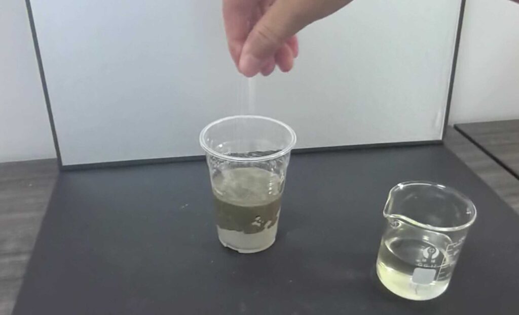 Grouting ratio experiment showing test tubes with different sodium silicate to reactant ratios demonstrating gel time and solidification results