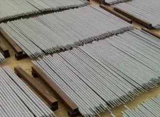 Potassium and sodium silicate binders used in welding electrode manufacturing showing coating extrusion and drying process