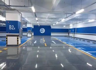 Densified concrete parking garage floor treated with silicate sealer showing hard dust-free surface with vehicles and deicing salt protection