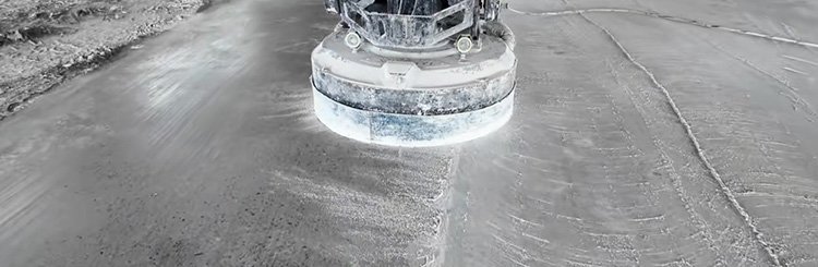 Fine grinding and polishing of concrete floor with resin diamond pads showing progression from matte to high gloss finish