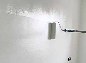 Potassium silicate architectural mineral coating applied to historic building facade showing matte finish and chemical bonding with mineral substrate