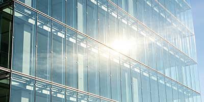 Potassium silicate fire-resistant glass curtain wall system showing laminated glass construction with intumescent gel interlayer and structural framing