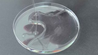 Sodium silicate solidify process showing liquid water glass transforming into solid gel after CO2 exposure or chemical reaction