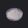 Instant sodium silicate powder white free-flowing powder in glass beaker showing fine uniform texture for detergent and construction applications