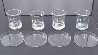 What is water glass - Sodium silicate solution in glass beaker with solid cullet pieces and molecular structure diagram